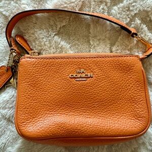 Coach Orange Leather Bag with Signature Style